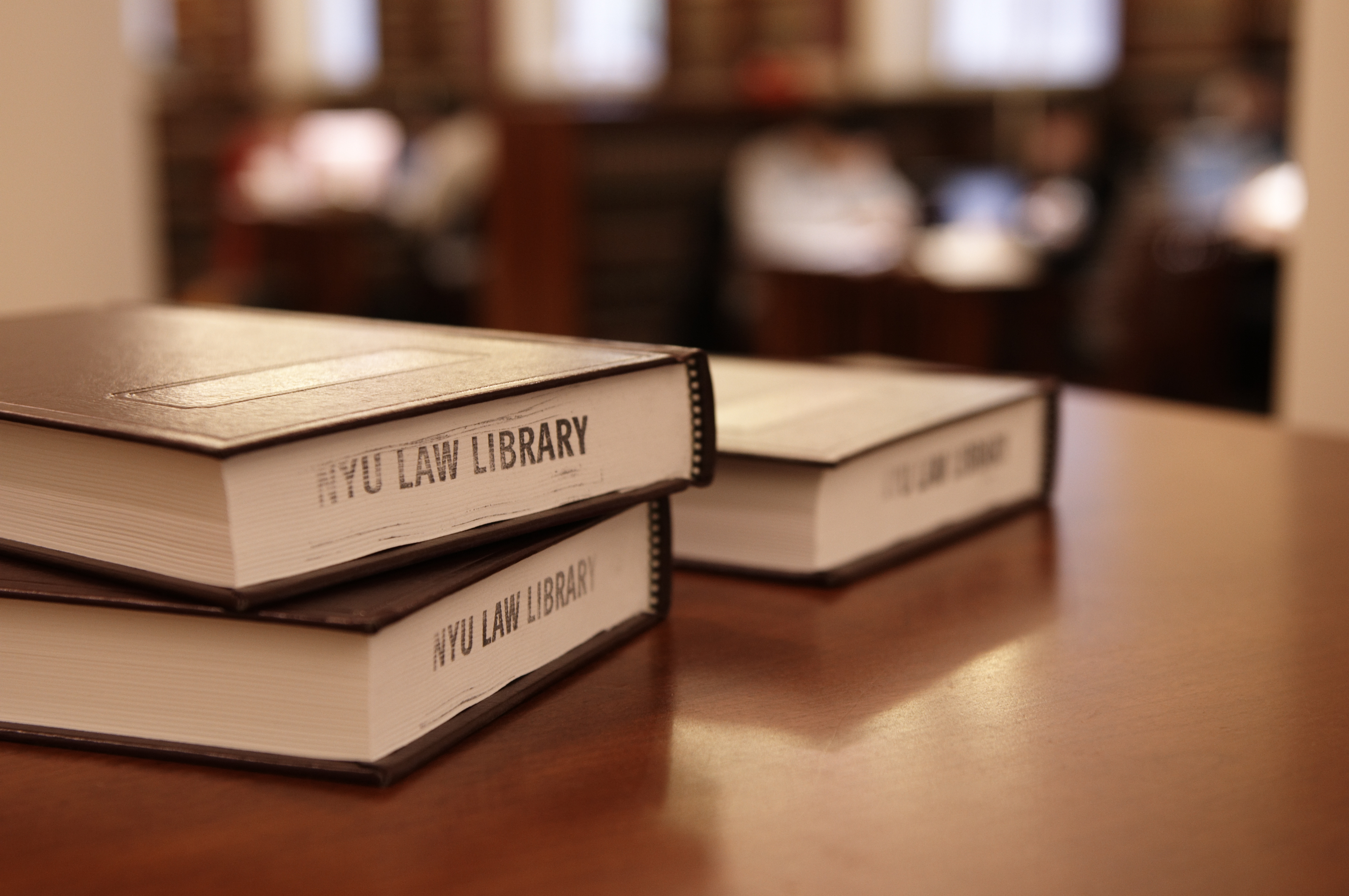 Three books on a table