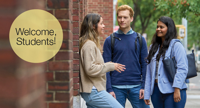 Three students talking with message "Welcome, Students!"