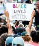 Black Lives Matter protesters holding signs