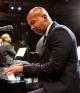 Bryan Stevenson playing the piano