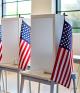 Voting booths with American flags