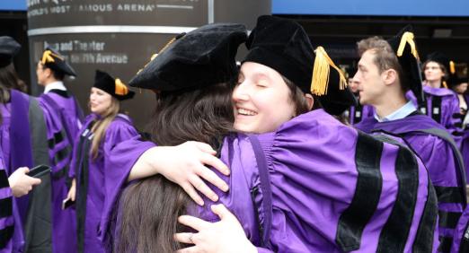Two people hugging at Convocation 